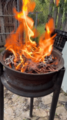 Makeshift fire pit burns twigs in Bulgarian village
