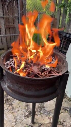 Makeshift fire pit burns twigs in Bulgarian village