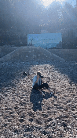Early morning beach photo shoot features unconventional plastic dress