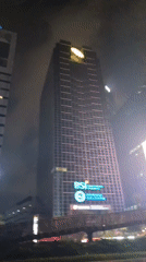 Jakarta's CBD skyline and streets lit up at night