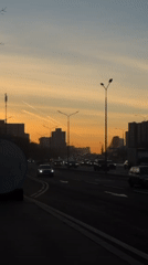 Dawn traffic scene captured on Moscow street