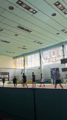Indoor volleyball game captured at morning facility