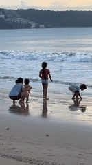 Family enjoys morning beach time in Kuta, Indonesia