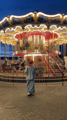 Evening leisure activities captured at illuminated Sochi park carousel area