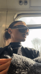 Woman in sunglasses rides public transport in Sevenoaks