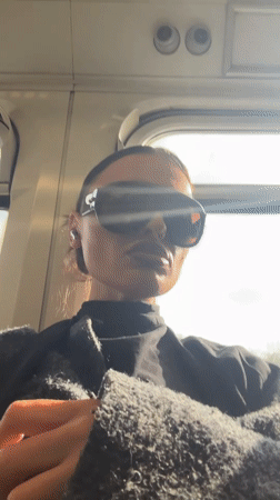 Woman in sunglasses rides public transport in Sevenoaks