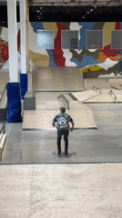 Rollerblader practices tricks at indoor skate park in Krasnoyarsk
