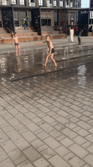 Children play in fountain on sunny day in Astrakhan