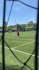 Soccer match played on turf field in Accra