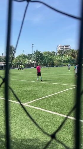 Soccer match played on turf field in Accra