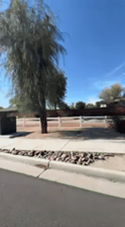 Woman filmed in passenger seat during sunny drive in Indio