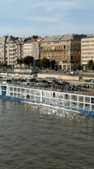 River cruise ships dock along Budapest's Danube during afternoon