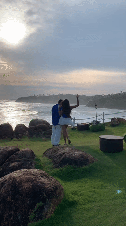 Couples pose for photos at scenic Mirissa coastline overlook