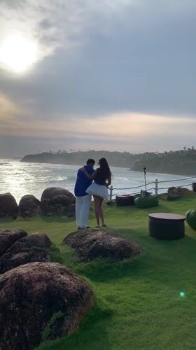 Couples pose for photos at scenic Mirissa coastline overlook