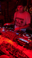 Late-night DJ set observed in dimly lit Cholula venue