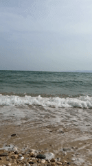 Overcast afternoon documented at quiet Greek beach