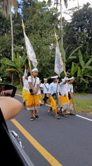 Traditional Balinese procession through the streets of Tampaksiring