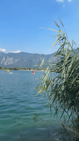 Lazy summer afternoon at Lake Calceranica, Italy