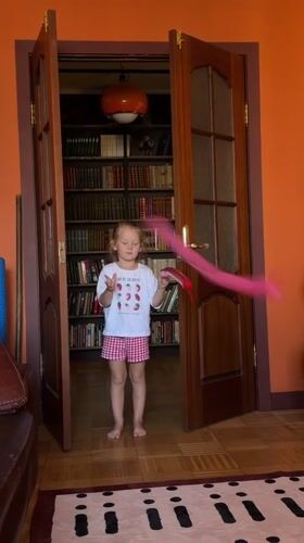 Quiet domestic morning in Khimki — cooking, a parrot, and city views