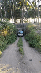 Dump trucks loaded with dark soil at a site in Ijobalit