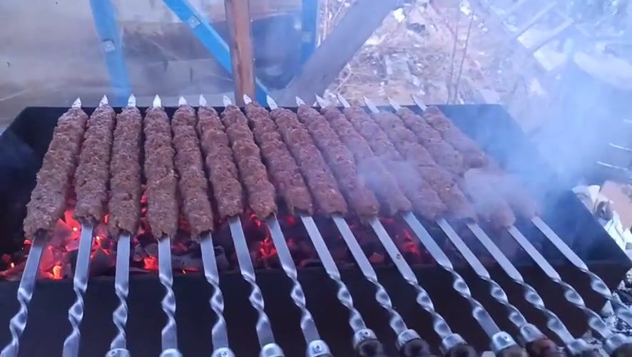 Outdoor barbecue with meat skewers observed in Nizhnevartovsk