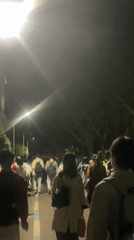 Night crowd walks through Chongqing High-tech Zone streets