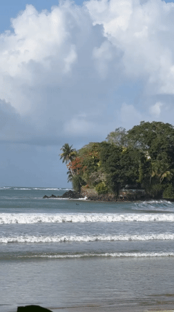 Weligama's rocky coast, surf, and beached fishing boats