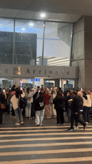 Crowd celebrates at Yerevan airport arrivals entrance