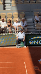 Tennis match documented at Roland Garros stadium in Paris
