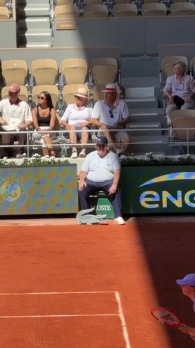 Tennis match documented at Roland Garros stadium in Paris