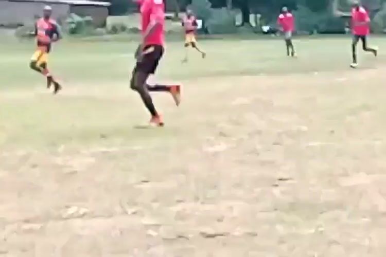 Soccer match played on rural field in Lugari, Kenya