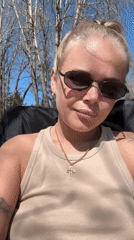 Beach picnic with couple, Chihuahua in red vest documented