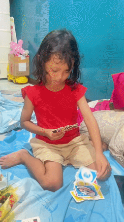 Lazy afternoon indoors in Gelam — corn, cards, and downtime