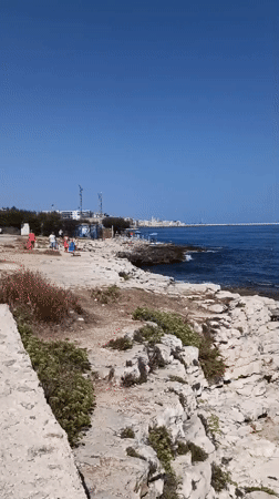 Rocky Adriatic coastline with Molfetta visible in the distance