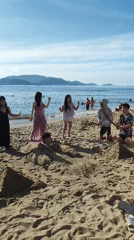 Beach group buries a friend in the sand at Nha Trang
