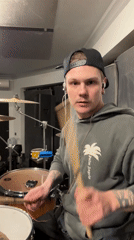 Drummer performs behind plastic enclosure in Шемякино, Russia