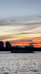 Ferry crosses Kazan waters during colorful sunset display