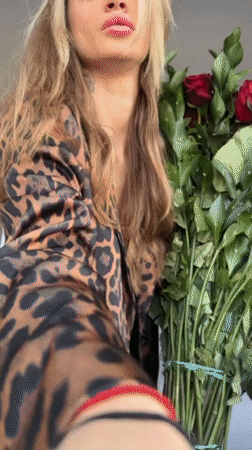 Woman receives roses and ring in Cologne hotel room