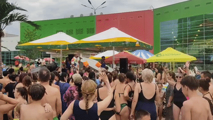Swimwear crowd gathers for live performance at Almaty water event