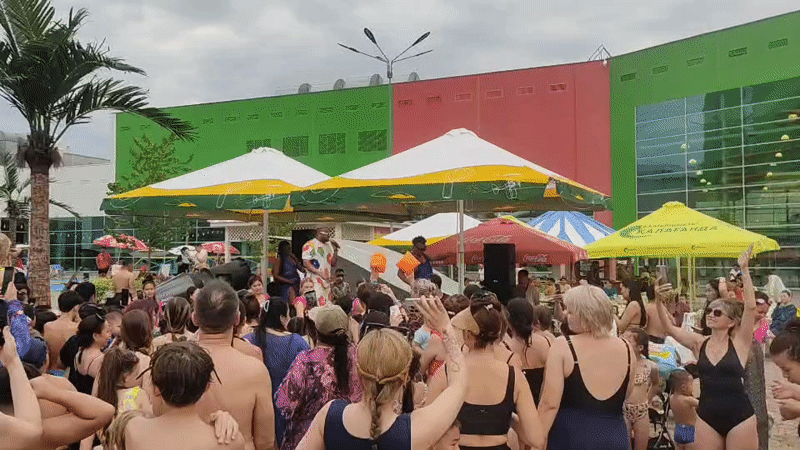 Swimwear crowd gathers for live performance at Almaty water event