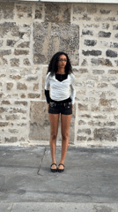 Urban photos capture woman and pedestrians on city sidewalk