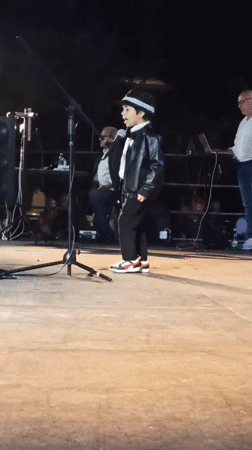 Live night performance on an outdoor stage in Bitonto, Italy