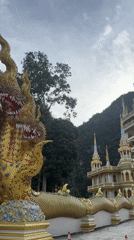 Ornate Buddhist temple with golden naga statues, Ban Khao Tang