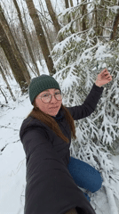 Woman films winter selfies in Russian forest near Kamennyi Kliuch