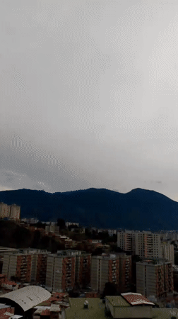 Overcast morning reveals Caracas's dense hillside neighborhoods