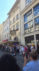Street life across central Lviv on a summer afternoon