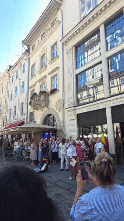 Street life across central Lviv on a summer afternoon