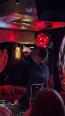 DJ performs to dancing crowd at Moscow nightclub