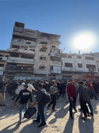 Crowds gather amid building damage, casualties in Gaza City