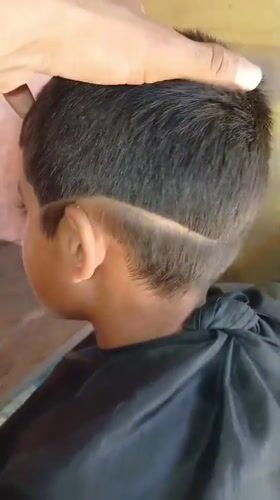 Child gets haircut in Porlamar, Venezuela